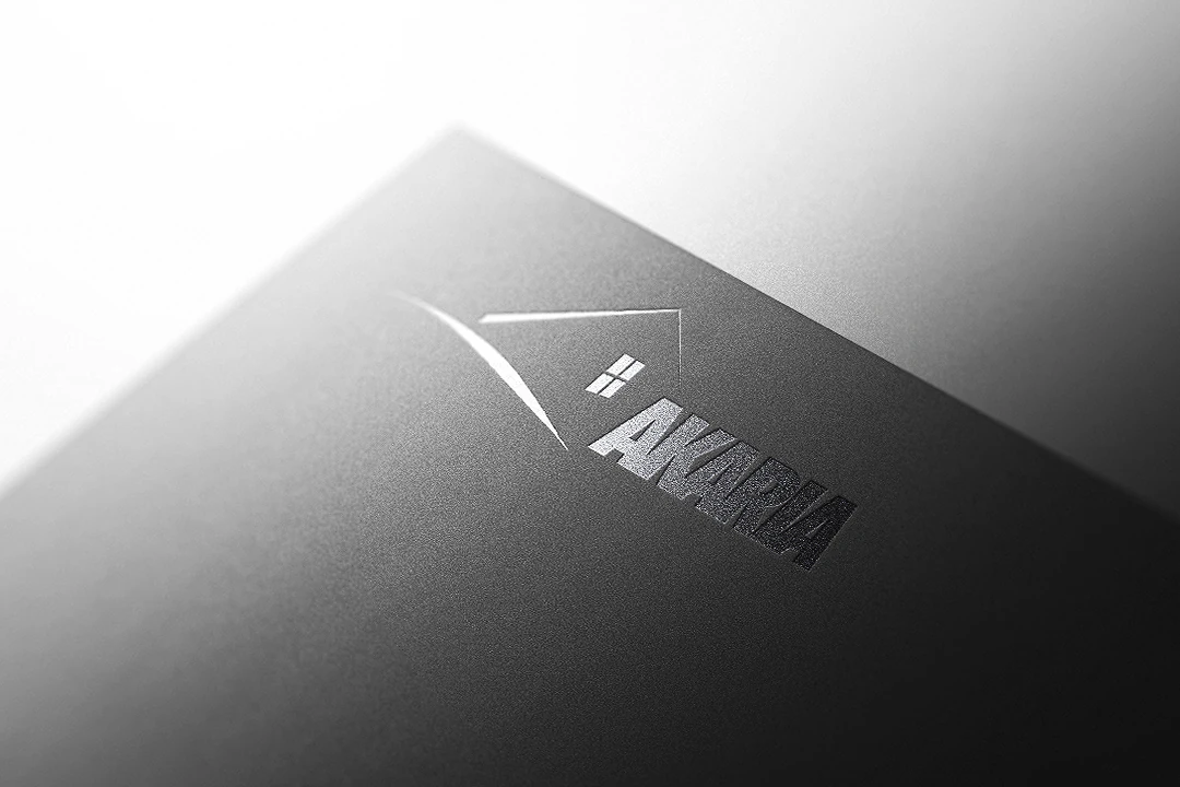 Akaria identity embossed on dark textured stationery